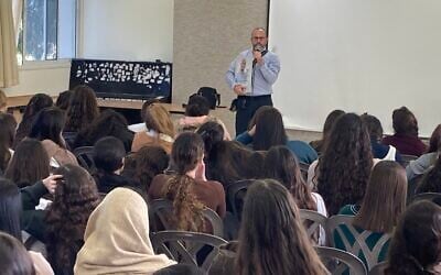 Tzvika Mor lectures to students at the Tohar religious Zionist high school for girls in Yad Binyamin on December 25, 2023. (Mati Wagner)