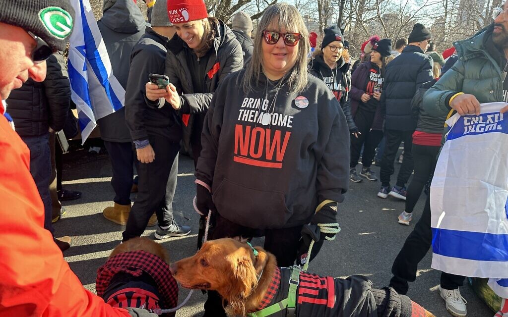 Illustrative: A participant of Run for Their Lives joins the weekly demonstration together with her dogs in Central Park, New York, January 14, 2024. (Jordana Horn/Times of Israel)