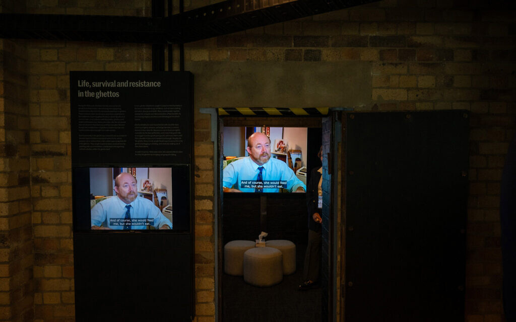 Rabbi Uri Thermal shares stories of hiding during the Holocaust in this video display at the Queensland Holocaust Museum in Brisbane, Australia, June 2023. (Queensland Holocaust Museum and Education Center)