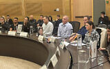 Families of young female surveillance soldiers killed on October 7 attend a hearing in the Knesset, January 9, 2024. (Sam Sokol)