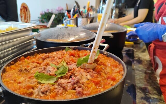 Food being prepared by Shekoufeh 'Chicki' Elghanian and volunteers at her Herzliya apartment, on December 28, 2023. (Gavriel Fiske/TOI)