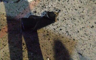 A hole in the road caused by a grenade that was thrown at the Shikma jail in Ashkelon, January 10, 2024. (Israel Prison Service Spokesperson's Unit)