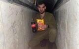 An IDF soldier with Bamba and Coke in what appears to be a Hamas tunnel in Gaza, part of the 'Operation Juha' civilian charity initiative, in an undated photo. (courtesy)