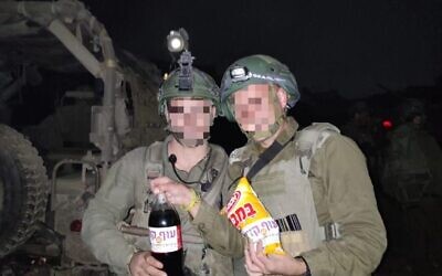 IDF soldiers with Bamba and Coke, part of the 'Operation Juha' civilian charity initiative, in an undated photo. (courtesy)