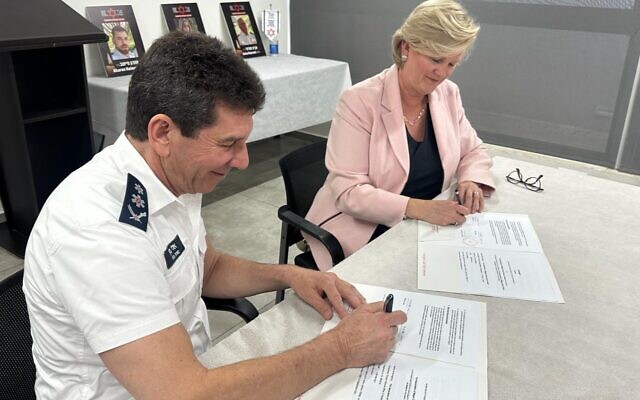 Finland's ambassador to Israel Dr. Nina Nordström signs a collaborative agreement with Magen David Adom on January 16, 2024. (MDA)