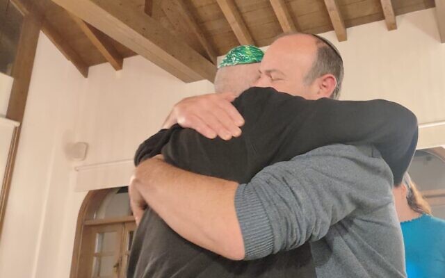 Participants hug at a bereaved parents retreat at the Secret Forest center in Cyprus, on January 20, 2024. (Gavriel Fiske/TOI)
