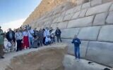 Mostafa Waziry standing in front of the renovation project of the Menkaure Pyramid at Giza, Egypt, January 26, 2024. (Facebook screenshot; used in accordance with Clause 27a of the Copyright Law)