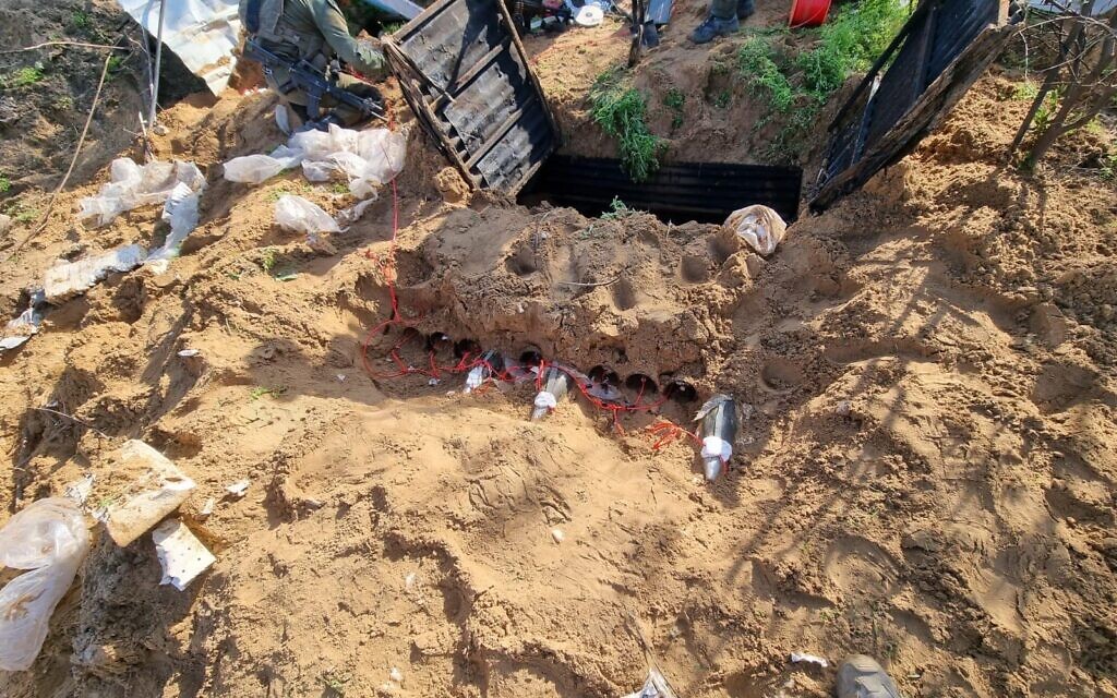 IDF troops find rocket launchers and rockets next to a tunnel shaft in the northern Gaza Strip's Beit Lahiya, in a handout photo released for publication on January 7, 2024. (Israel Defense Forces)