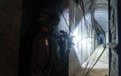 Israeli troops operate inside a Hamas tunnel in the Khan Younis area, in an image released by the IDF on January 23, 2024. (Israel Defense Forces)
