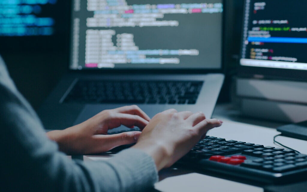 For illustration: Closeup of hands typing on a keyboard. (Nattakorn Maneerat via iStock)