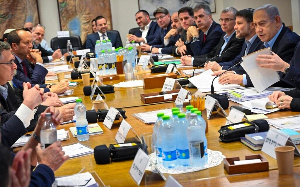 Prime Minister Benjamin Netanyahu, right, leads a cabinet meeting at the Kirya IDF headquarters in Tel Aviv, January 7, 2024. (Kobi Gideon/GPO)