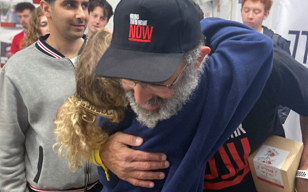 Nir Moses, the son of released hostage Margalit Moses, hugs a student participating in the Maccabee Task Force trip to Israel in January 2024. (Courtesy/ Nir Rotman)