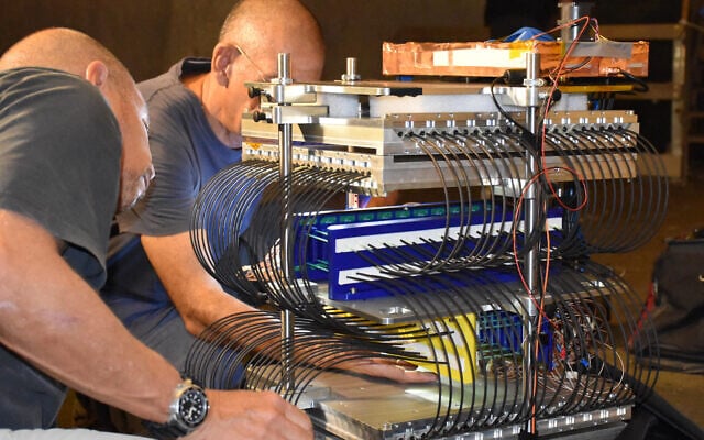 Researchers build a muon detector in a cave under the City of David in 2023. (Courtesy: Gilad Mizrachi / Tel Aviv University)