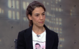 Merav Svirsky, wearing a shirt picturing her hostage brother, Itay Svirsky, who was murdered by Hamas in captivity. (KAN11)