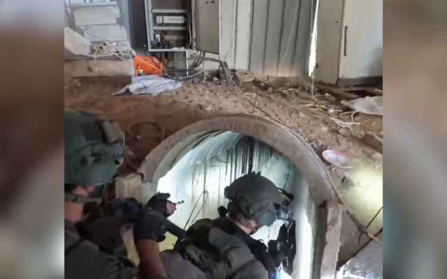 IDF soldiers at the entrance to a Hamas tunnel found in the central Gaza Strip and located just one and a half kilometers from the Israeli border, January 24, 2024. (Screenshot/Israel Defense Forces) IDF soldiers at the entrance to a Hamas tunnel found in the central Gaza Strip and located just one and a half kilometers from the Israeli border, January 24, 2024. (Screenshot/Israel Defense Forces)