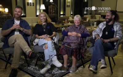 Sarah Jackson (2nd right) sits with three revelers who fled the Supernova festival massacre and sheltered in her Kibbutz Sa'ad home, in a Channel 12 report, January 25, 2024. (Channel 12 screenshot: used in accordance with Clause 27a of the Copyright Law)