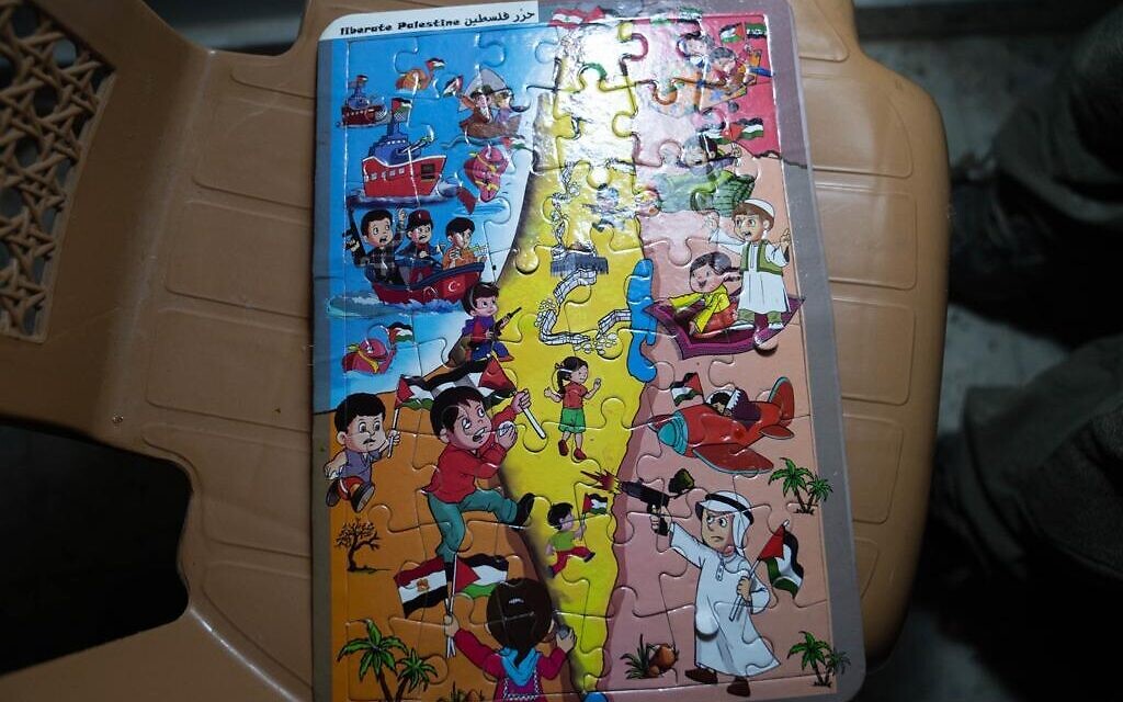 A children's jigsaw puzzle with the caption 'Liberate Palestine' featuring armed kids in an inciting image against Israel, found by troops in a Khan Younis home. Photo released January 6, 2024 (Israel Defense Forces)