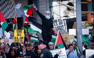 Pro-Palestinian, anti-Israel demonstrators at a rally in Times Square, October 13, 2023. (Luke Tress / JTA)
