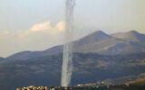 This picture taken from an Israeli position along the border with southern Lebanon shows rockets fired from Lebanon into Israel on February 26, 2024. (Jalaa Marey/AFP)