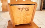 A tzedakah box for charitable giving in the foyer of a synagogue in Lafayette, California, Jan. 20, 2022. (Smith Collection/Gado/Getty Images)
