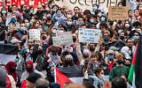 Anti-Israel protesters gather in Harvard Yard at a rally in Cambridge, Massechusetts, October 14, 2023. (Joseph Prezioso / AFP)