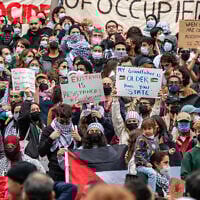 Anti-Israel protesters gather in Harvard Yard at a rally in Cambridge, Massechusetts, October 14, 2023. (Joseph Prezioso / AFP)