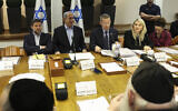 Prime Minister Benjamin Netanyahu (2nd left) heads the weekly cabinet meeting alongside Cabinet Secretary Yossi Fuchs (3rd left) and Finance Minister Bezalel Smotrich (1st left) at the Defense Ministry in Tel Aviv on January 7, 2024. (RONEN ZVULUN / POOL / AFP)