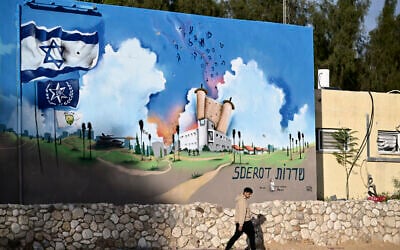 A man walks past the Sderot police station that was attacked by Hamas terrorists on October 7, in the southern Israeli city of Sderot near the Gaza border on January 8, 2024, during ongoing battles between Israel and the Hamas. (Alberto PIZZOLI/AFP)