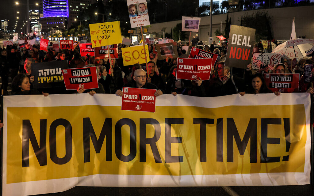 Demonstrators block a main road demanding an immediate deal for the release Israeli hostages held in the Gaza Strip by Palestinian terrorists, during a protest near the Defense Ministry in Tel Aviv on February 1, 2024. (Ahmad Gharabli/AFP)