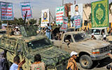 Military vehicles parade during a pro-Palestinian rally in Yemen's Houthi-held capital Sanaa on February 7, 2024 amid the ongoing war in the Gaza Strip between Israel and the Palestinian terror group Hamas. (Mohammed Huwais/AFP)