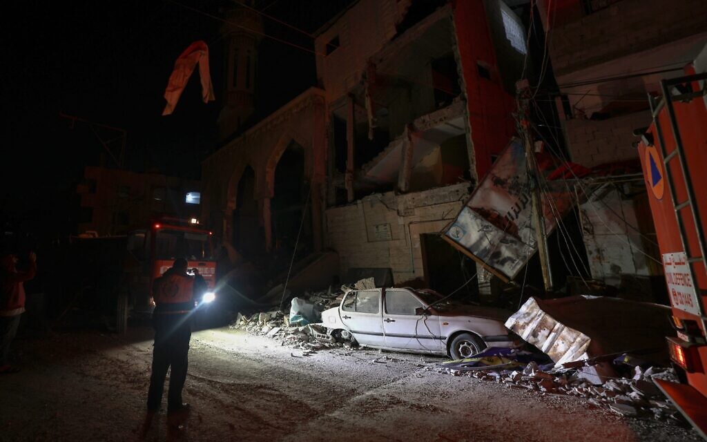 Rescue workers survey the scene following Israeli strikes in Rafah in the southern Gaza Strip on February 12, 2024 (MOHAMMED ABED / AFP)