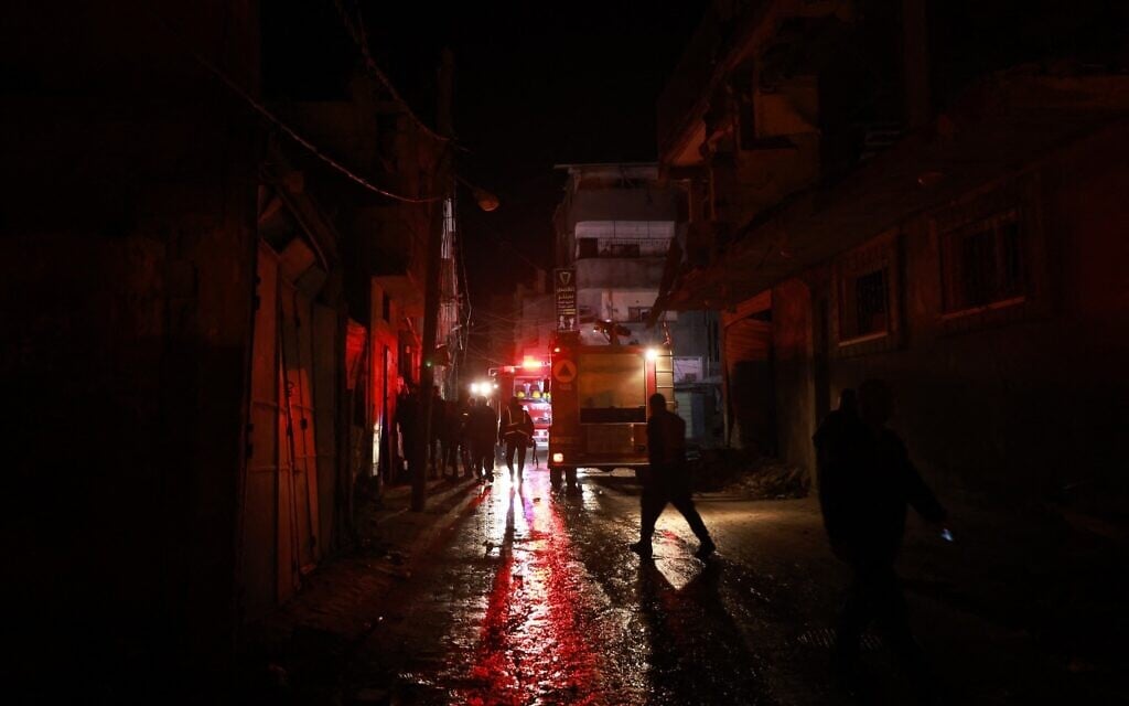 Rescue workers survey the scene following Israeli strikes in Rafah in the southern Gaza Strip on February 12, 2024 (MOHAMMED ABED / AFP)