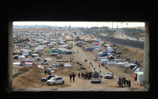 Displaced Palestinians camp near the border fence between Gaza and Egypt, on February 16, 2024, in Rafah, in the southern Gaza Strip, amid the ongoing conflict between Israel and Hamas. (Mohammed Abed/AFP) Displaced Palestinians camp near the border fence between Gaza and Egypt, on February 16, 2024, in Rafah, in the southern Gaza Strip, amid the ongoing conflict between Israel and Hamas. (Mohammed Abed/AFP)