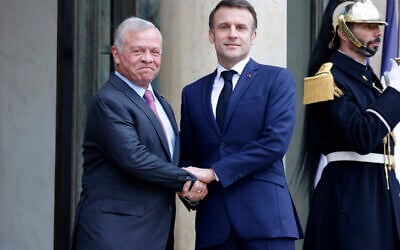 File - French President Emmanuel Macron welcomes King Abdullah II of Jordan before a meeting at the Elysee Palace in Paris, on February 16, 2024. (Photo by Ludovic MARIN / AFP)