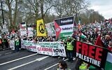 Pro-Palestinian activists and supporters wave flags and carry placards during a National March for Palestine in central London on February 17, 2024. (JUSTIN TALLIS / AFP)