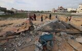 Palestinians inspect destruction in Rafah following an Israeli airstrike on February 18, 2024. (Mohammed Abed/AFP)