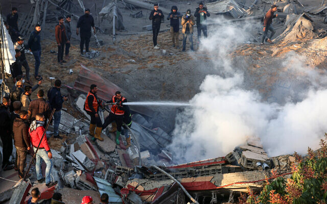 Members of the Palestinian civil defense extinguish a fire in a building following Israeli strikes east of Rafah in the southern Gaza Strip on February 19, 2024 (SAID KHATIB / AFP) Members of the Palestinian civil defense extinguish a fire in a building following Israeli strikes east of Rafah in the southern Gaza Strip on February 19, 2024 (SAID KHATIB / AFP)