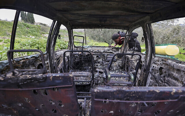 A Palestinian man inspects a car burnt in a reported attack the previous night by Israeli settlers in the village of Burqa, northwest of Nablus in the West Bank, on February 20, 2024. (Zain Jaafar/AFP) A Palestinian man inspects a car burnt in a reported attack the previous night by Israeli settlers in the village of Burqa, northwest of Nablus in the West Bank, on February 20, 2024. (Zain Jaafar/AFP)