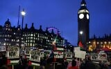 Pro-Palestinian, anti-Israeli demonstrators wave Palestinian flags and hold placards as they protest in Parliament Square in London on February 21, 2024, while a motion in the the House of Commons calling for an immediate ceasefire in Gaza was debated. (Adrian DENNIS / AFP)