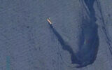 A handout picture released on February 23, 2024, shows the M/V Rubymar, a Belize-flagged, UK-owned bulk carrier leaking oil in the Gulf of Aden after taking significant damage after an attack by Iran-backed Houthi terrorists on February 18. (CENTCOM)