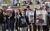 Released hostage Sharon Alony Cunio speaks as crowds gather before the start of a four-day march to Jerusalem calling for the release of the hostages held by Hamas, on February 28, 2024, at the site of the Supernova music festival in southern Israel. (Photo by JACK GUEZ / AFP)
