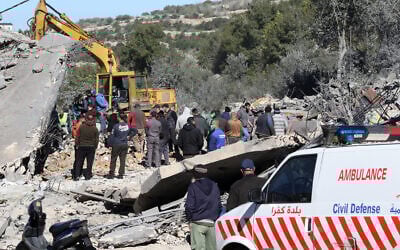 Residents and rescuers check the destruction after an overnight Israeli strike in the southern Lebanese village of Kafra, on February 29, 2024 (Photo by MAHMOUD ZAYYAT / AFP)