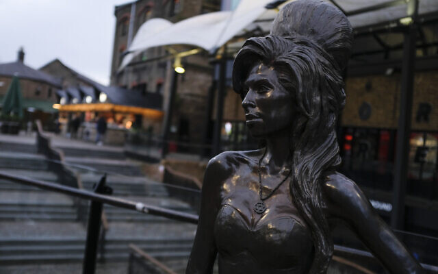 A statue of the late singer, Amy Winehouse in the Camden Market, London, December, 2020. (AP Photo/Alberto Pezzali) A statue of the late singer, Amy Winehouse in the Camden Market, London, December, 2020. (AP Photo/Alberto Pezzali)