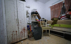 Blood is seen splattered in a bedroom following a massive Hamas terrorist attack in Kibbutz Ein Hashlosha, Israel, Thursday, Oct. 26, 2023. (AP Photo/Tsafrir Abayov)