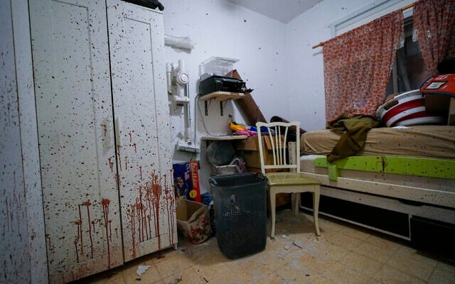 Blood is seen splattered in a bedroom following a massive Hamas terrorist attack in Kibbutz Ein Hashlosha, Israel, Thursday, Oct. 26, 2023. (AP Photo/Tsafrir Abayov)