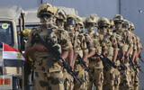 Egyptian military personnel stand alert at the Rafah border crossing between Egypt and Gaza Strip, in Rafah, Egypt, October 31, 2023. (AP/Mohammed Asad)