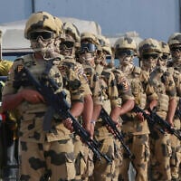 Egyptian military personnel stand alert at the Rafah border crossing between Egypt and Gaza Strip, in Rafah, Egypt, October 31, 2023. (AP/Mohammed Asad)
