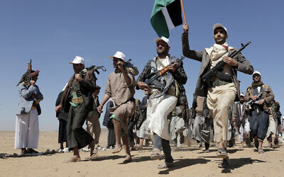 File - Houthi fighters march during a rally of support for the Palestinians in the Gaza Strip and against the US strikes on Yemen outside Sanaa on January 22, 2024. (AP Photo)