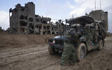 An Israeli soldier stands guard during the ground offensive on the Gaza Strip in Khan Younis, January 27, 2024. (AP Photo/Sam McNeil)