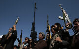 Houthi fighters stage a rally in support of the Palestinians in the Gaza Strip and against the US-led airstrikes on Yemen, in Sanaa, Yemen, January 29, 2024. (AP Photo/Osamah Abdulrahman)